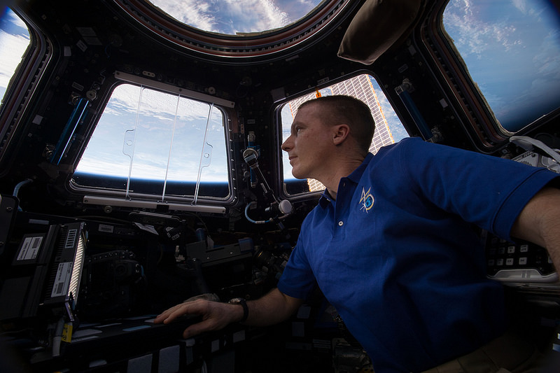 NASA astronaut and Expedition 43 crew member Terry Virts enjoying the view from the Cupola. Photo Credit: NASA