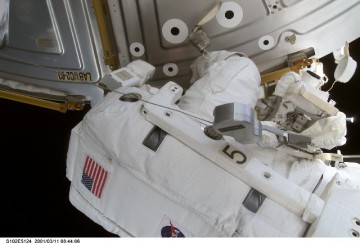 Susan Helms works at the U.S. Destiny laboratory module during the EVA. Photo Credit: NASA