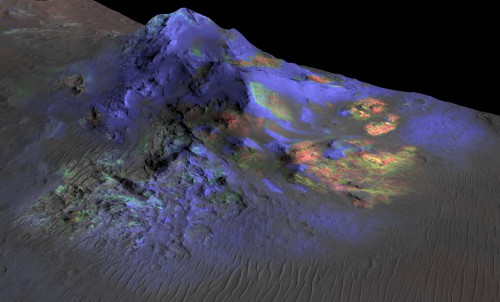 Image from the Compact Reconnaissance Imaging Spectrometer for Mars (CRISM) instrument on the Mars Reconnaissance Orbiter, showing deposits of impact glass in Alga Crater (green). Image Credit: NASA/JPL-Caltech/JHUAPL/Univ. of Arizona