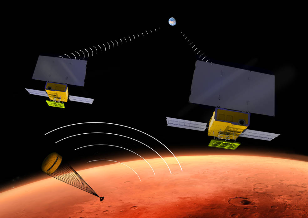 Artist's conception of the MarCO CubeSats flying past Mars as the InSight lander descends to the surface. Image Credit: NASA/JPL-Caltech