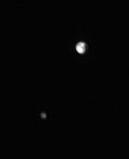 New Horizons captured the four images used to make this view on June 6, 2015 from a distance of 46 million kilometers. Four images have been stacked and sharpened. The dark line running across Pluto is likely a real feature, not a processing artifact. Charon is still too small for any apparent features to be definitively discerned. Image Credit/Caption: NASA / JHUAPL / SwRI / Björn Jónsson/Emily Lakdawalla