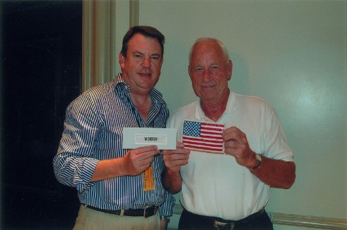 Leon Ford (left) and astronaut Al Worden pose with a flag worn by Worden during Apollo 15. Photo Credit: RR Auction