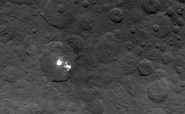 The brightest of the bright spots on Ceres, in Occator crater. Haze detected above them may help scientists determine if they are made of ice, salts or something else. Photo Credit: NASA/JPL-Caltech/UCLA/MPS/DLR/IDA