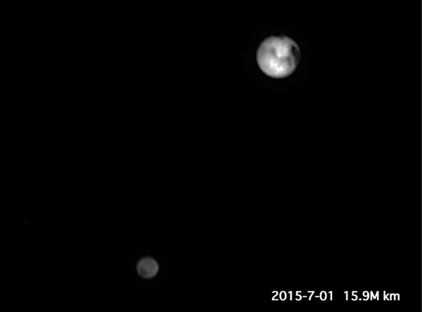Pluto and Charon as photographed by New Horizons' powerful LORRI telescopic camera on July 1, 2015. Photo Credit: NASA/JHUAPL/SWRI/processing by Ron Baalke