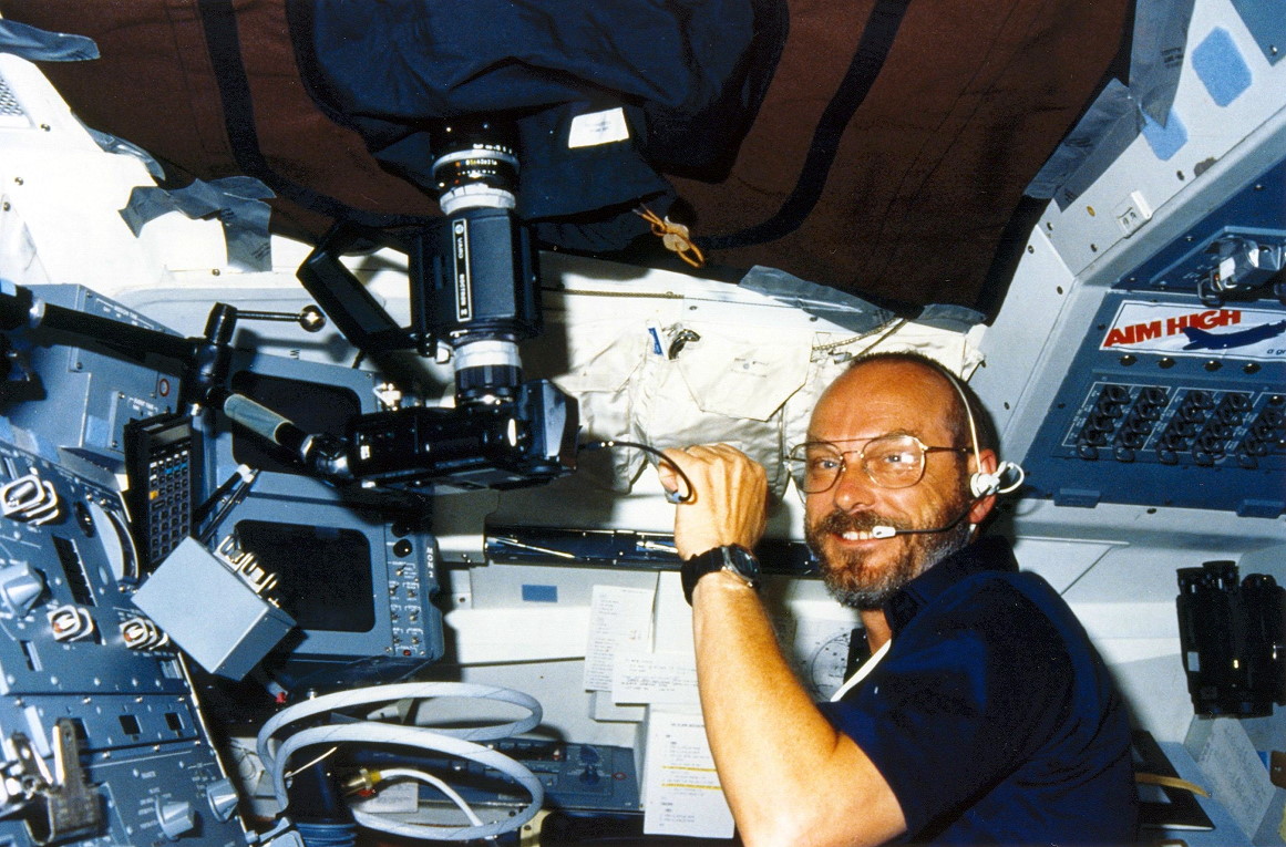 Loren Acton works with cameras and equipment on Challenger's aft flight deck. Photo Credit: NASA, via Joachim Becker/SpaceFacts.de