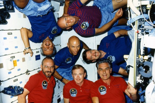 In July 1985, Karl Henize (lower right) became the oldest human to enter space, aged 58. His record lasted a little over five years. Photo Credit: NASA, via Joachim Becker/SpaceFacts.de