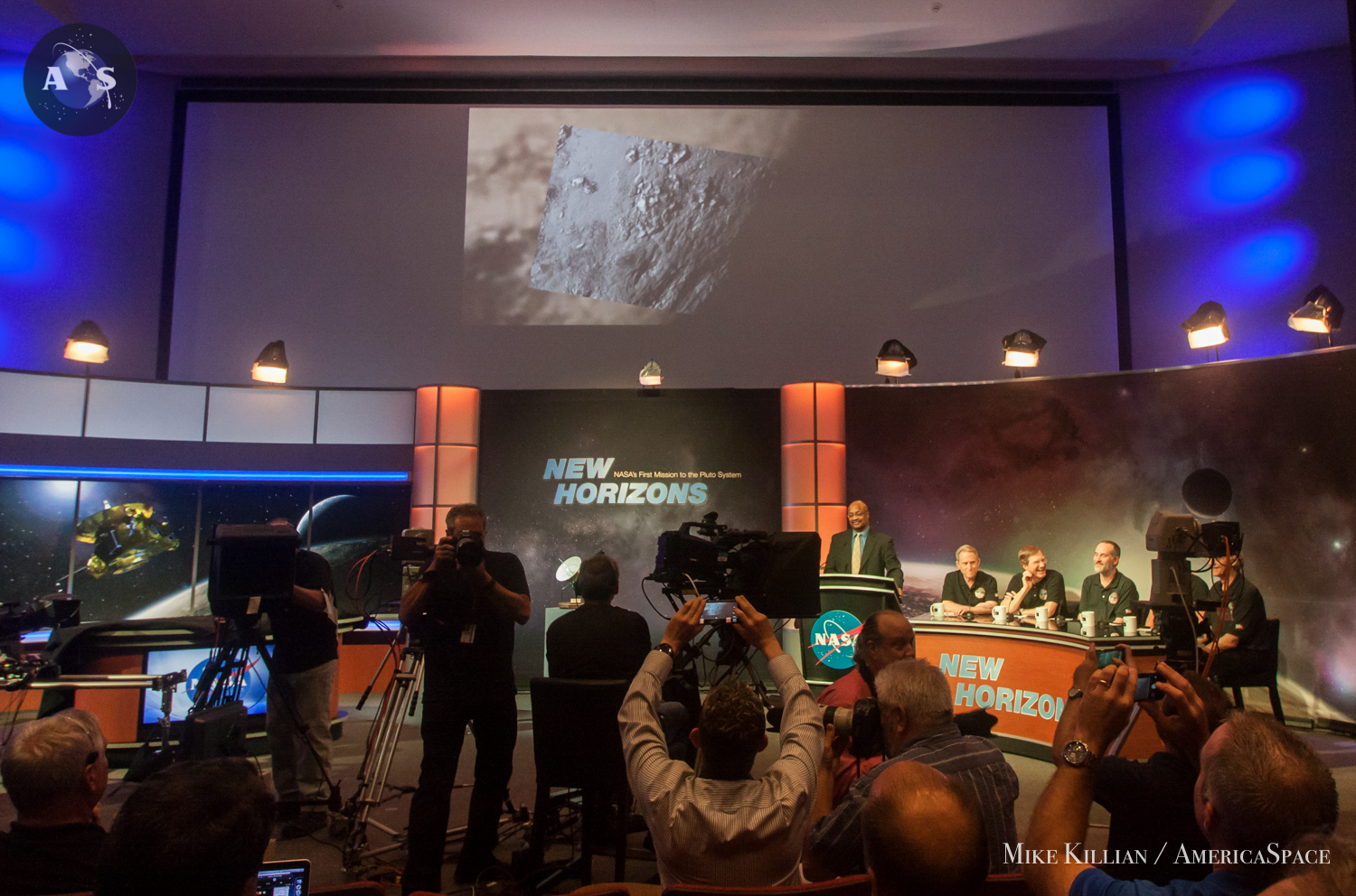 The first ever close-up photo of Pluto's surface revealed to the world at the Johns Hopkins Applied Physics Laboratory in Laurel, MD on July 15, 2015. Photo Credit: Mike Killian / AmericaSpace