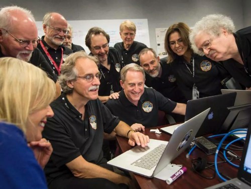 The New Horizons mission team reacts on July 15, 2015 to seeing the first data and images from their spacecraft's flyby through the Pluto system. Photo Credit: NASA