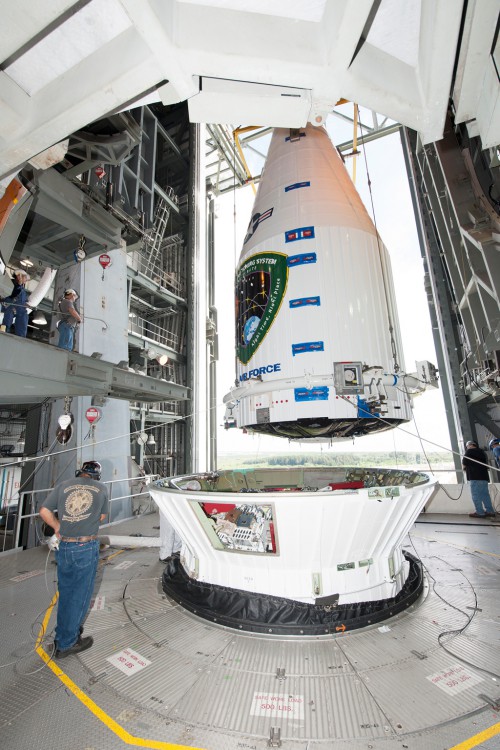 The Air Force's GPS IIF-10 satellite, encapsulated inside a 4-meter payload fairing, is mated to an Atlas V rocket at the Vertical Integration Facility or VIF. Photo: ULA