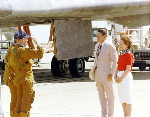 Commander Ken Mattingly and Pilot Hank Hartsfield salute President Ronald Reagan and First Lady Nancy Reagan on Edwards' concrete Runway 22 on Independence Day in 1982. Columbia is clearly visible in the background. Photo Credit: NASA