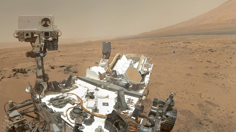 Self-portrait of the Curiosity over in Gale crater on Mars. Part of Mount Sharp is in the background. Image Credit: NASA/JPL-Caltech/MSSS