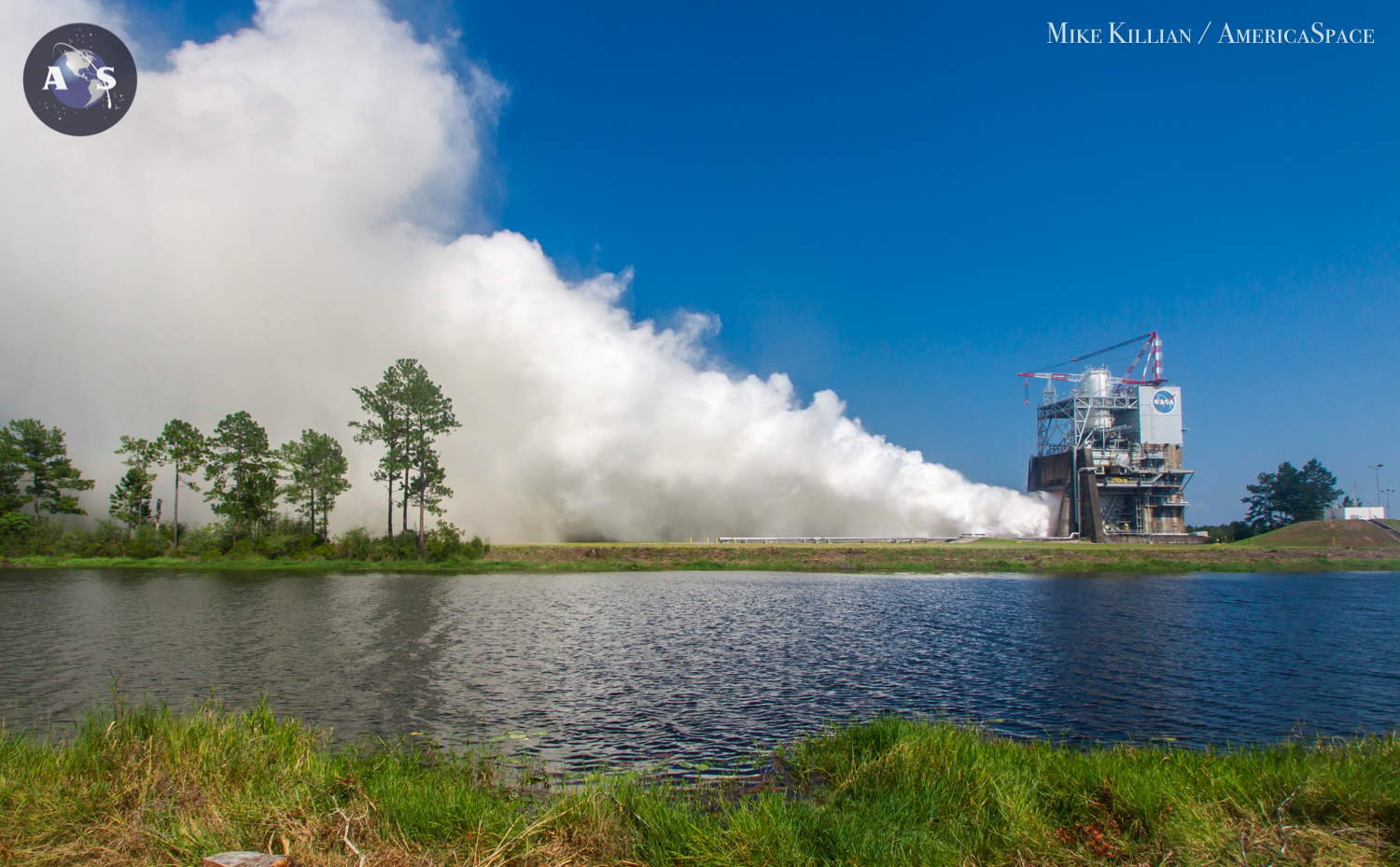 The world's most efficient rocket engine unleashing 512,000 pounds of thrust and a thunderous roar across southern Mississippi and NASA's Stennis Space Center during a 535-second full power test fire in August 2015. The same engine that powered the space shuttle so reliably for years, the RS-25, will again be employed for NASA's Space Launch System, upgraded to meet the new requirements for what will become the most powerful rocket in history. Photo Credit: Mike Killian / AmericaSpace
