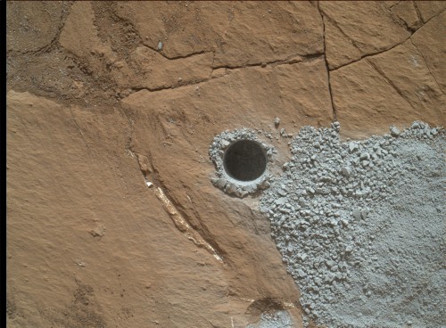 The drill hole in the Buckskin rock target. Analysis by the rover shows high levels of silica and hydrogen in these and nearby rocks. Image Credit: NASA/JPL-Caltech/MSSS 
