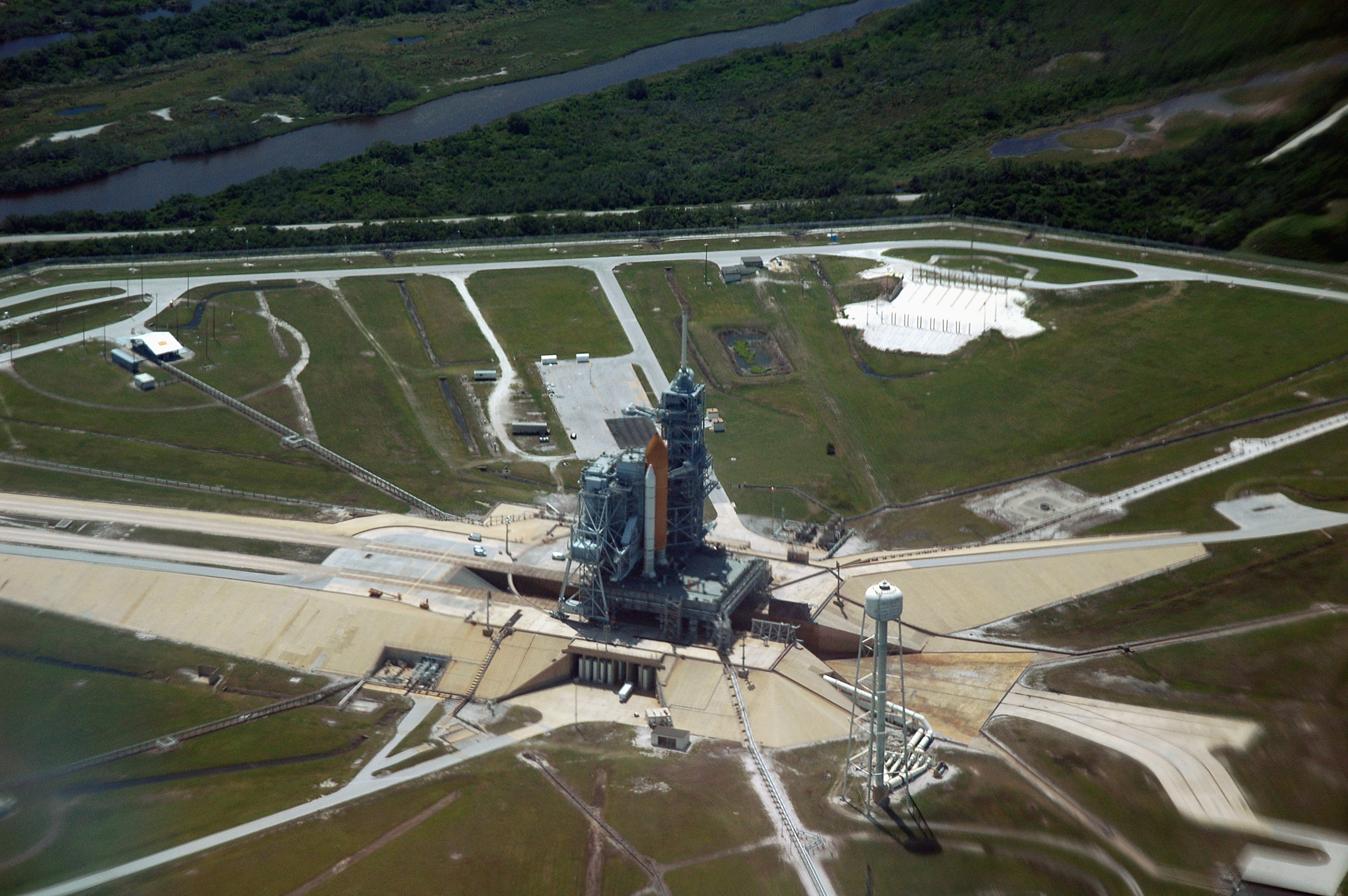 Pictured on Pad 39B in April 2005, Discovery would weather a rollback and second pad flow before finally reaching orbit on 26 July. Photo Credit: NASA