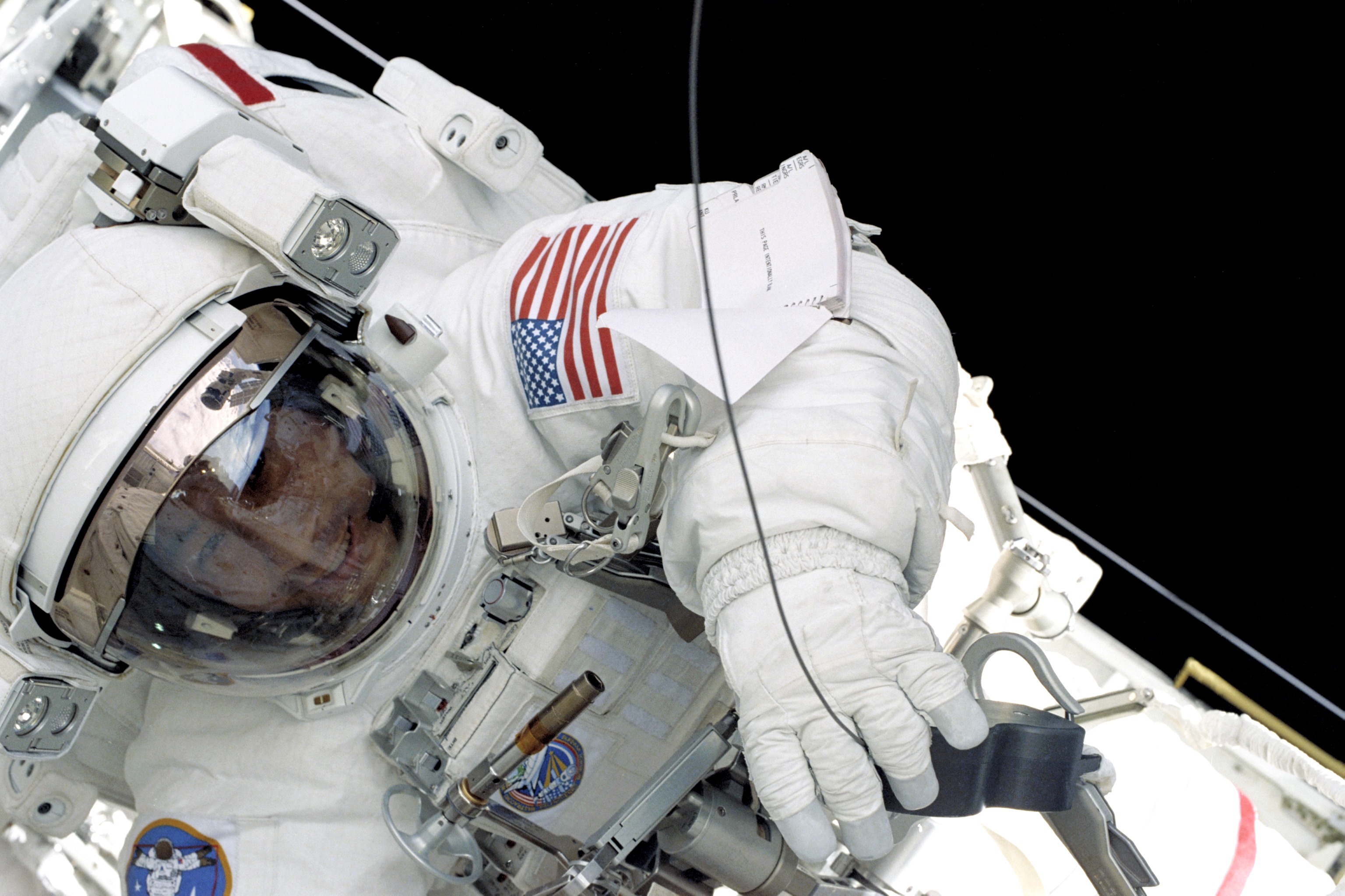 Ed Lu was making the first and only EVA of his three-mission career as an astronaut. Photo Credit: NASA