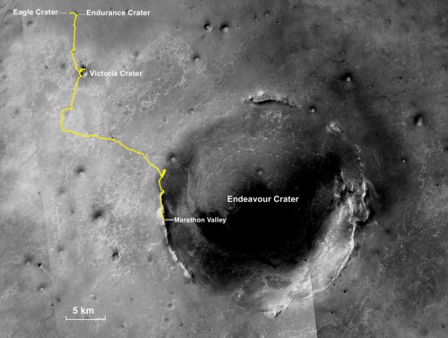 An orbital image of the 22-km-wide Endeavour Crater, which has been Opportunity's home for the last four years, taken from NASA's Mars Reconnaissance Orbiter. The yellow line indicates the path that has been traversed by Opportunity since its landing inside Eagle Crater in 2004 (upper left) until its arrival on Marathon Valley earlier this year. Image Credit: NASA /JPL-Caltech / MSSS / NMMNHS