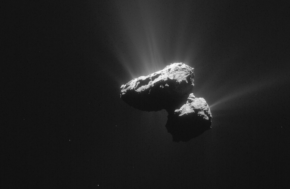 Image from July 14, 2015 showing the double-lobed or "rubber duck" shape of Comet 67P and outgassing of water vapor, gas and dust. Image Credit: ESA/Rosetta/NAVCAM – CC BY-SA IGO 3.0