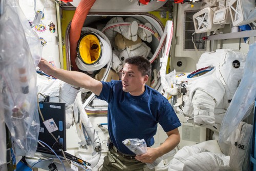 Kjell Lindgren performs routine maintenance on Extravehicular Mobility Units (EMUs) in the Quest airlock, last month. In October-November, Lindgren and Scott Kelly will perform the first two EVAs of their respective careers. Photo Credit: NASA