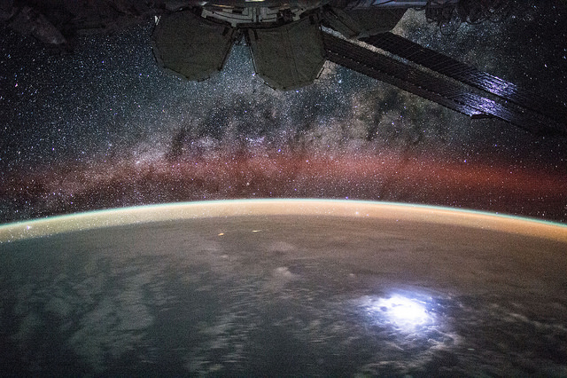 Stunning view of an Earth-based lightning strike of such intensity that its glow is reflected by the solar arrays of the International Space Station (ISS). This view was acquired on 2 September by NASA astronaut Kjell Lindgren. Photo Credit: NASA