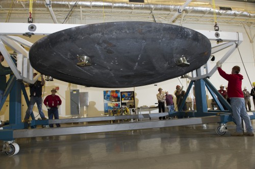 The Orion heat shield that flew on Exploration Flight Test 1, December 2014, arrives at Marshall Space Flight Center for machining and post-flight evaluation. Photo Caption and Credit: NASA 
