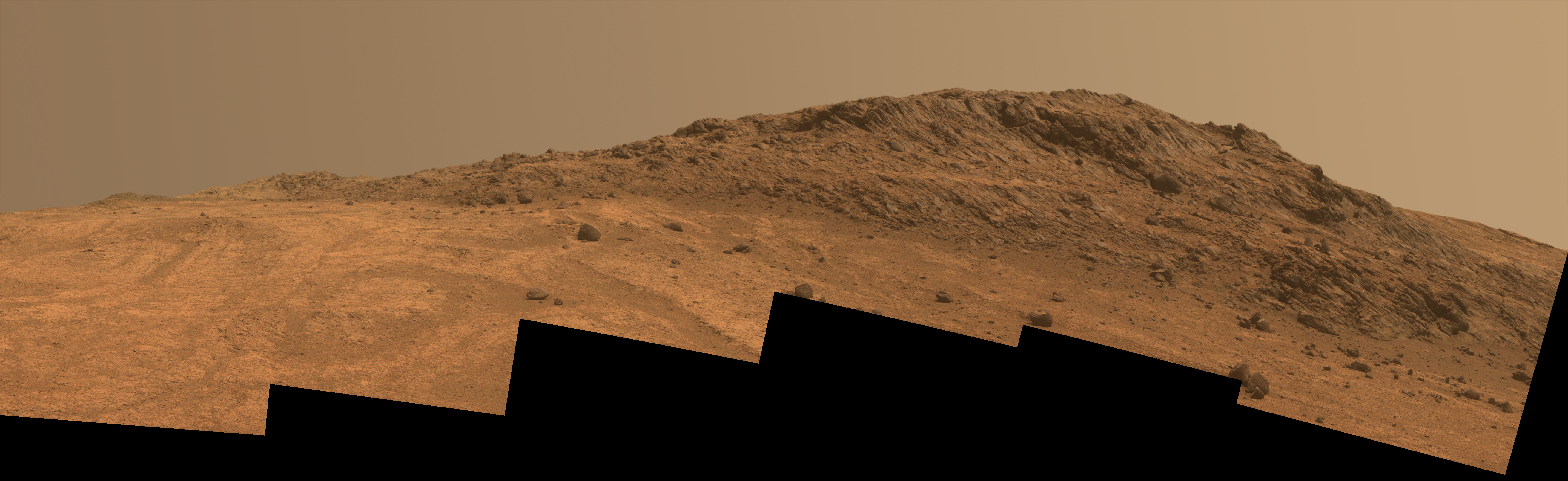 A view of the northern edge of Marathon Valley, taken by Opportunity on Aug. 14, 2015. The image, which is a collage of six individual frames from Opportunity's panoramic camera (Pancam), shows contrasting textures and colors at a place called Hinners Point (right) at the northern edge of Marathon Valley and swirling reddish zones on the valley floor to the left. Image Credit/Caption: NASA/JPL-Caltech/Cornell Univ./Arizona State Univ.