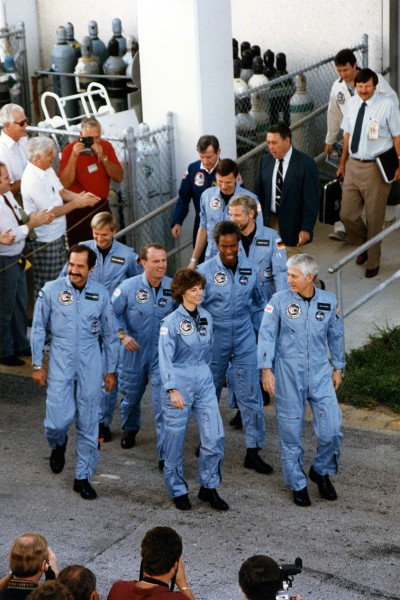 Led by white-haired Commander Hank Hartsfield, the crew of Mission 61A departs the Operations & Checkout (O&C) Building on 30 October 1985, bound for Pad 39A and their ship, Challenger. Photo Credit: NASA, via Joachim Becker/SpaceFacts.de