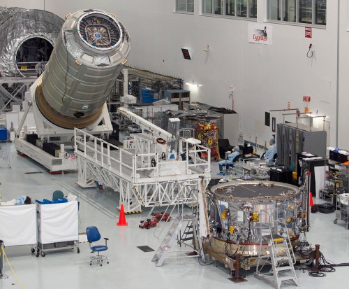 Engineers and technicians spent the last several days packing the pressurized portion of the Cygnus spacecraft before rotating the cylindrical module upright so it could be lifted to join the power-producing service module. Photo Credit: NASA