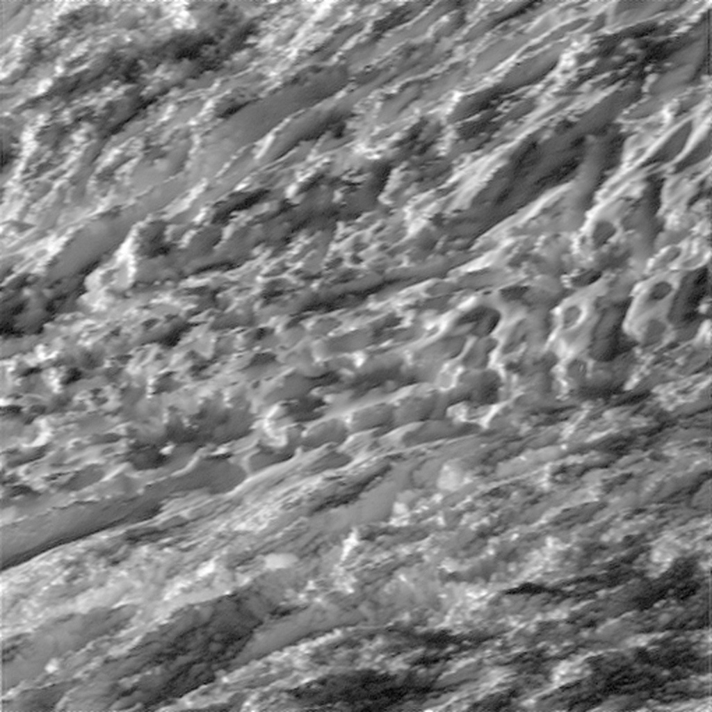Closeup view of the rugged surface of Enceladus in the region of the Tiger Stripes at the south pole. Image Credit: NASA/JPL-Caltech/Space Science Institute