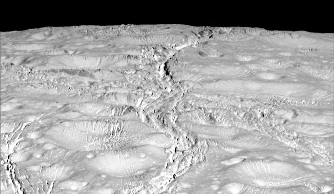 New high-resolution view of the north polar region on Enceladus, showing a cratered surface crisscrossed by many cracks. Image Credit: NASA/JPL-Caltech/Space Science Institute