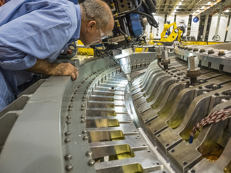 The aft bulkhead for the Exploration Mission (EM)-1 spacecraft welded to the barrel of the Orion pressure vessel at the Michoud Assembly Facility in New Orleans, Louisiana. Photo Credit: NASA / Radislav Sinyak 