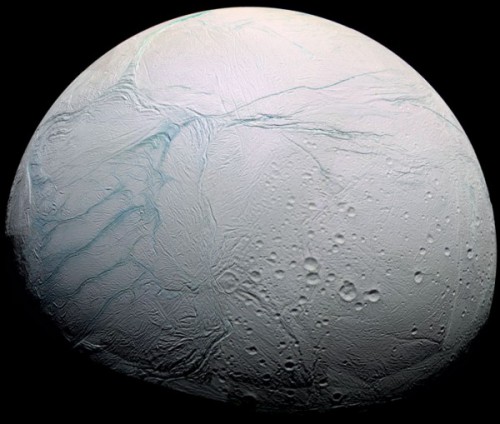 Enceladus, a tiny icy moon of Saturn, has a global ocean of water beneath its surface. The Tiger Stripe fissures, which the plumes erupt from, are visible on the left (actually the south pole). Image Credit: NASA/JPL-Caltech