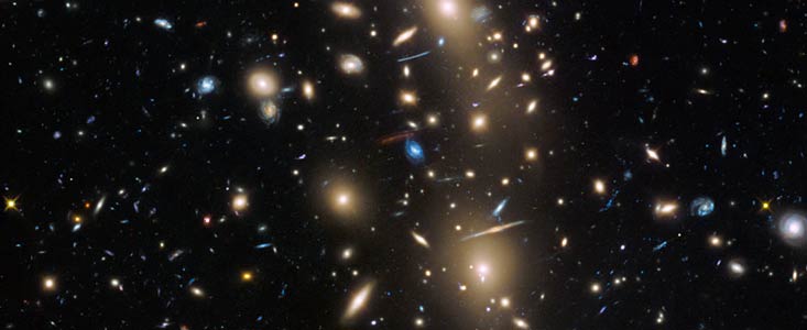 Hubble view of a galaxy cluster containing some of the smallest and youngest galaxies ever observed. Image Credit: NASA/ESA/HST Frontier Fields team (STScI)