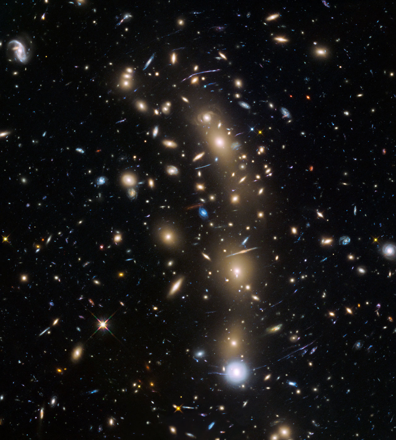 This image from the NASA/ESA Hubble Space Telescope shows the galaxy cluster MACS J0416.1–2403. This is one of six being studied by the Hubble Frontier Fields programme, which together have produced the deepest images of gravitational lensing ever made. Due to the huge mass of the cluster it is bending the light of background objects, acting as a magnifying lens. Astronomers used this and two other clusters to find galaxies which existed only 600 to 900 million years after the Big Bang.
