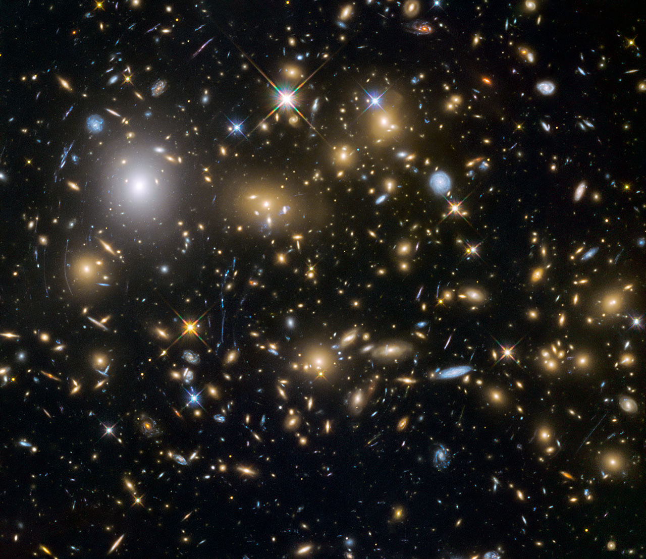 Wider view showing galaxy cluster MACSJ0717.5+3745. Image Credit: NASA/ESA/HST Frontier Fields team (STScI)