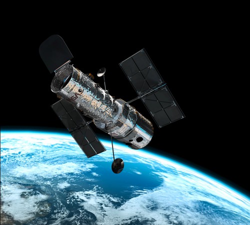 The Hubble Space Telescope in orbit above Earth. Photo Credit: ESA