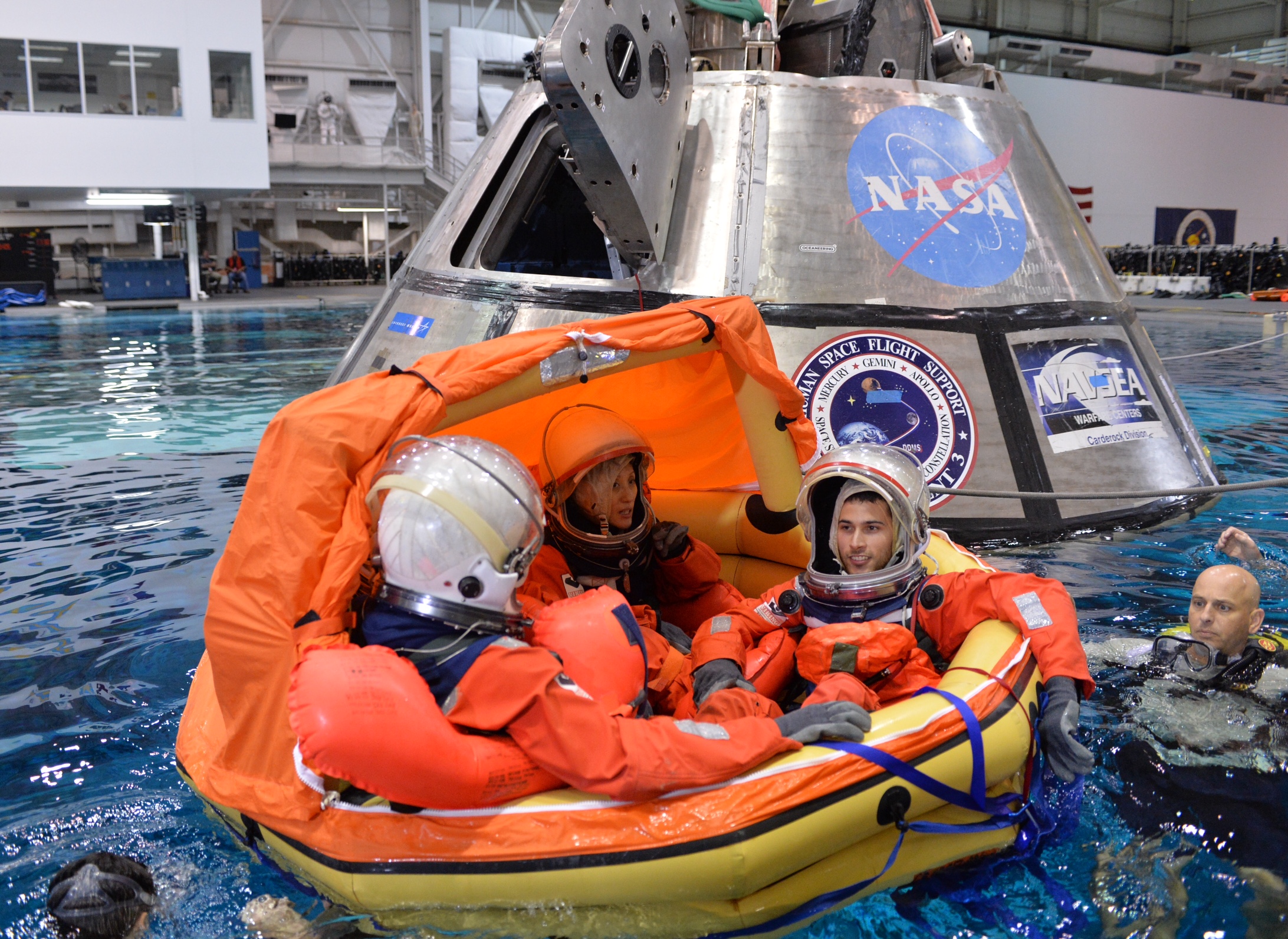 Engineers participate in testing to evaluate procedures to recover crews from Orion after splashdown in the Pacific Ocean on future missions. The training took place at the Neutral Buoyancy Laboratory at NASA’s Johnson Space Center in Houston. Caption and Credit: NASA