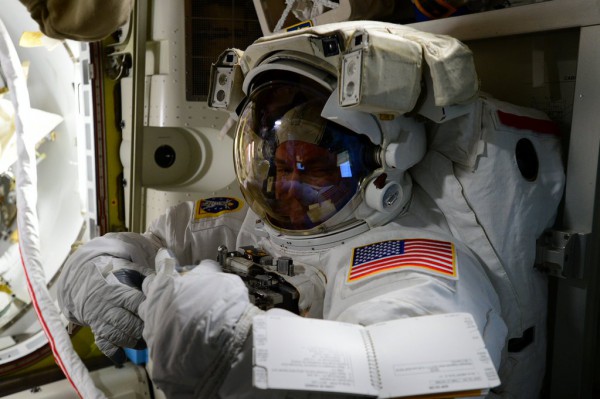 Putting his "EVA game face on", Scott Kelly undergoes a suited run-through of his tasks, prior to his first career EVA. Photo Credit: NASA/Twitter