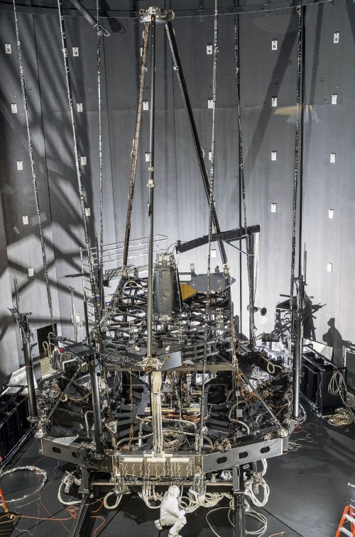 Engineers inspect the 'Pathfinder', an exact copy of the James Webb Telescope's optical systems, inside the cryo vacuum Chamber A at NASA’s Johnson Space Center during a series of recent tests to check the telescope's mirror segments in cryogenic conditions. Image Credit: NASA/Chris Gunn