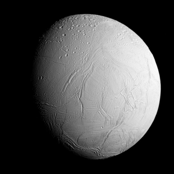 Enceladus as seen from a distance of 60,000 miles (96,000 kilometers) during the flyby. The northern hemisphere is heavily cratered, while the southern hemisphere is wrinkled and cracked, but relatively crater-free. Image Credit: NASA/JPL-Caltech/Space Science Institute