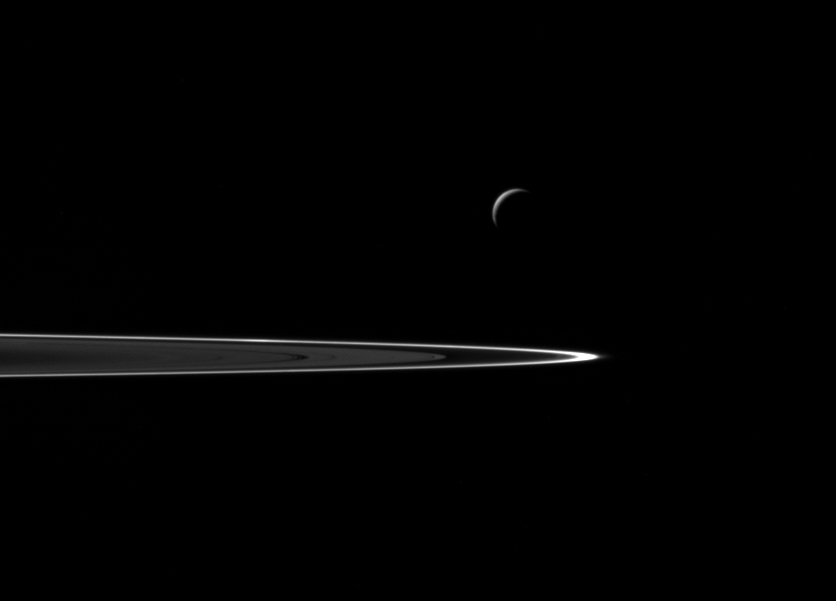 View of Enceladus and Saturn's rings during the flyby. Image Credit: NASA/JPL-Caltech/Space Science Institute