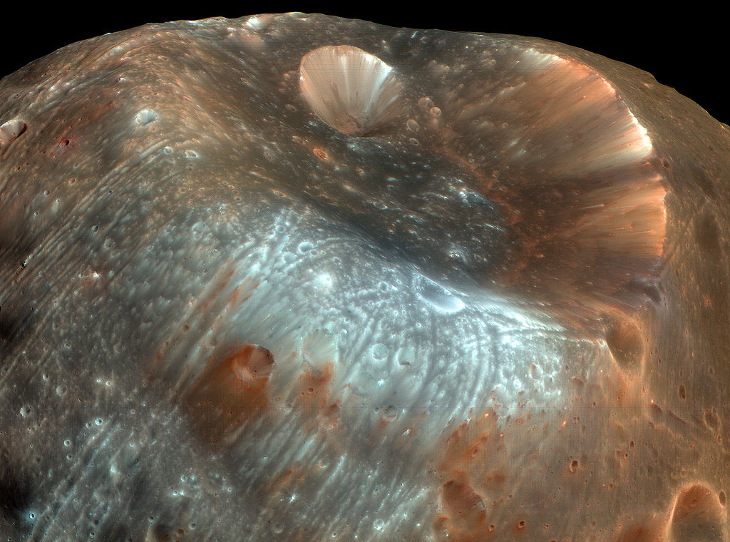 The unusual grooves on Phobos' surface, such as those on the left side of this image, are now thought to be caused by tidal stress. The large crater Stickney is in the upper portion of the image. Image Credit: NASA/JPL-Caltech/University of Arizona