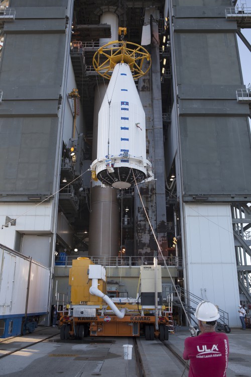 A crane lifts the Cygnus spacecraft, fitted inside a payload fairing, to the Vertical Integration Facility at Space Launch Complex 41 so the spacecraft can bolted to the top of the waiting United Launch Alliance Atlas V rocket. Photo Credit: NASA / Dmitri Gerondidakis