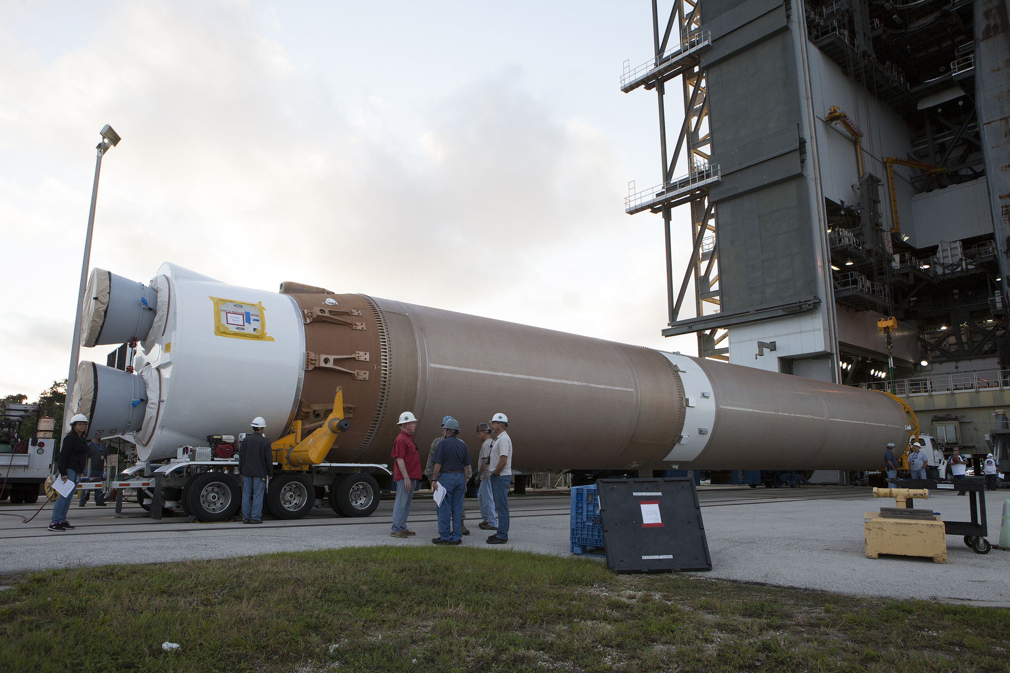 The ULA Atlas-V booster that will lift the Orbital ATK Enhanced Cygnus spacecraft into orbit arrives at the Space Launch Complex 41 Vertical Integration Facility on Cape Canaveral Air Force Station in Florida. Photo Credit: NASA/Kim Shiflett