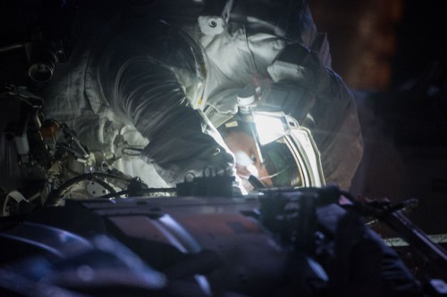 Kjell Lindgren, pictured at work during last week's U.S. EVA-28. For tomorrow's excursion, he will take the leading role in the restoration of the cooling system of the space station's P-6 truss to its pre-2012 configuration. Photo Credit: NASA