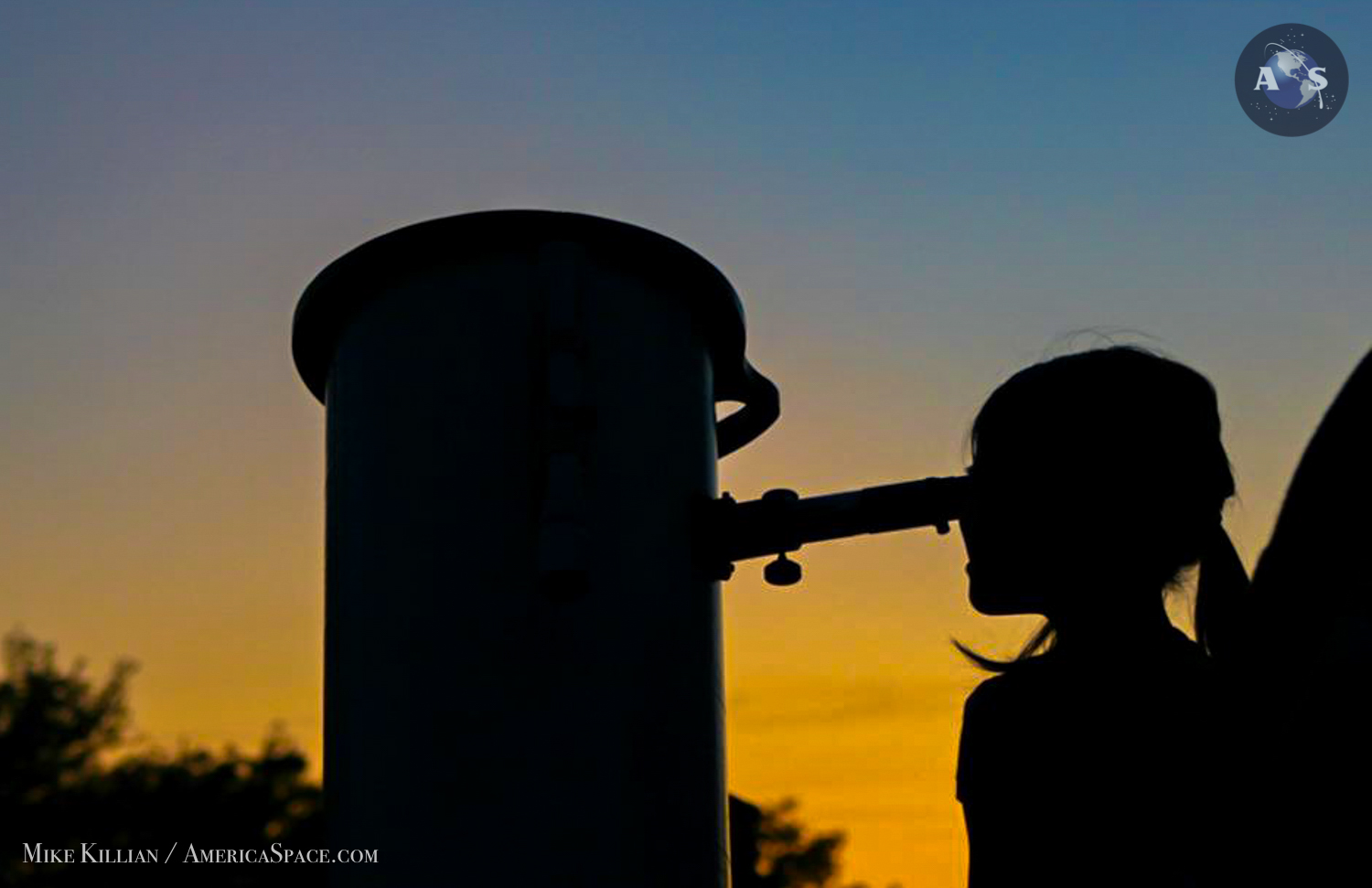 A young astronomer observes Comet C/2011 L4 (PANSTARRS) during a public outreach program at the Seminole State College Planetarium in central Florida March 16, 2013. Photo Credit: Mike Killian / AmericaSpace 