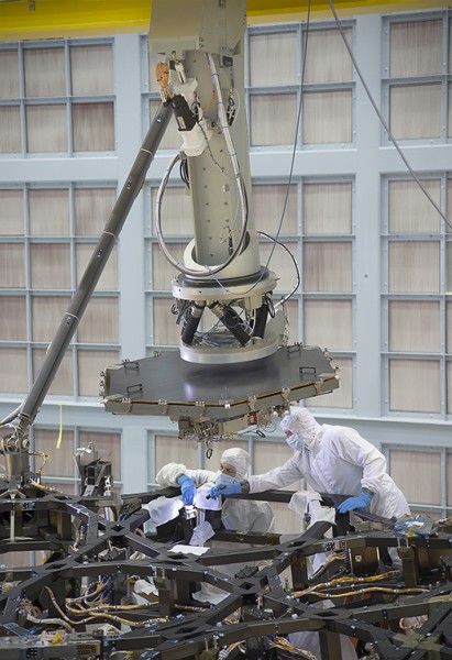 Another view of the installation process. Photo Credit: NASA/Chris Gunn