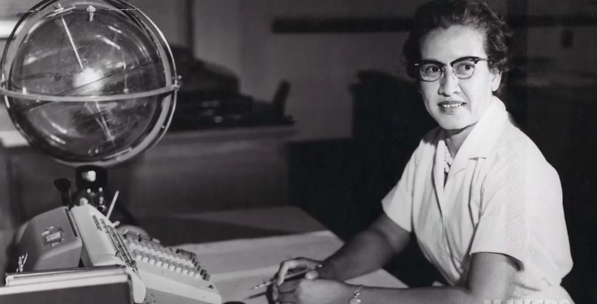 From NASA: "Katherine Johnson sits at her desk with a globe, or 'Celestial Training Device.'" Johnson's work as a research mathematician contributed to NASA's successes from the Mercury to the Shuttle programs, and beyond. Photo Credit: NASA