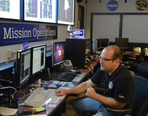 Flight controller George Lawrence monitors data from New Horizons at the New Horizons Mission Operations Center at the Johns Hopkins University Applied Physics Laboratory on Nov. 4, 2015. Image Credit: NASA/JHUAPL/SwRI