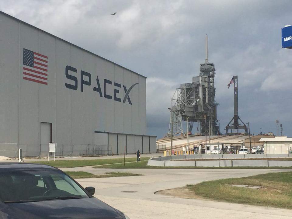 SpaceX's Horizontal Integration Facility (HIF), whose construction was completed in 2015, stands astride the "crawlerway", beyond the Pad 39A perimeter. Photo Credit: SpaceX Facebook Group, used with permission