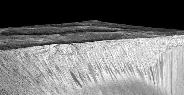 RSL emanating out of the walls of Garni crater. The streaks are narrow, but up to several hundred meters in length. Image Credit: NASA/JPL/University of Arizona